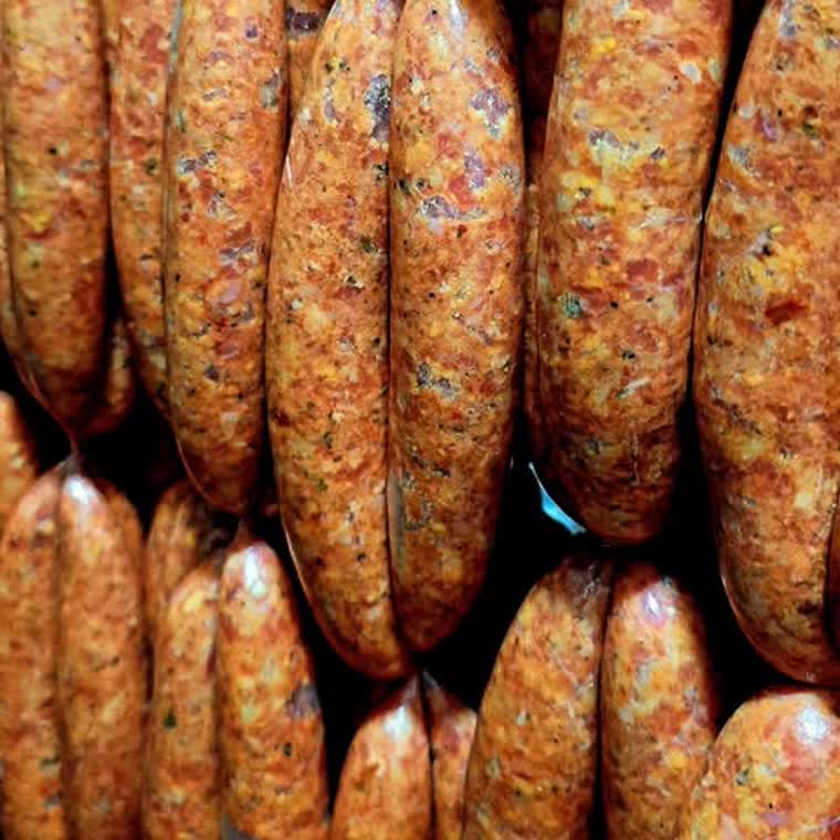 Rows of fresh sausages made in the shop